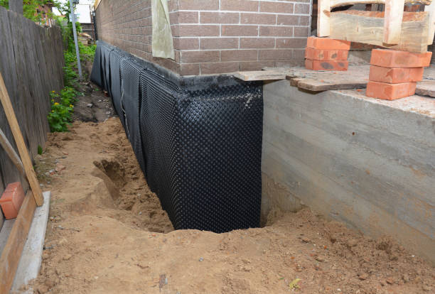 Happy homeowners after waterproofing job in Wyoming